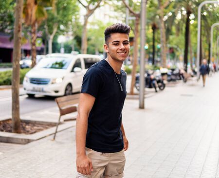 fashionable handsome man on the street of modern cityの写真素材