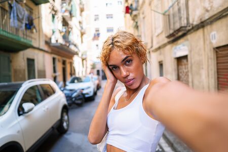 sexy shemale woman posing and doing selfieの写真素材