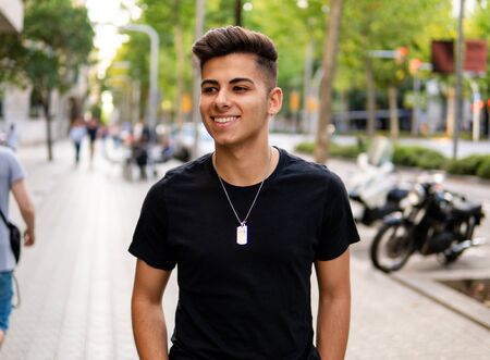 fashionable handsome man on the street of modern cityの写真素材