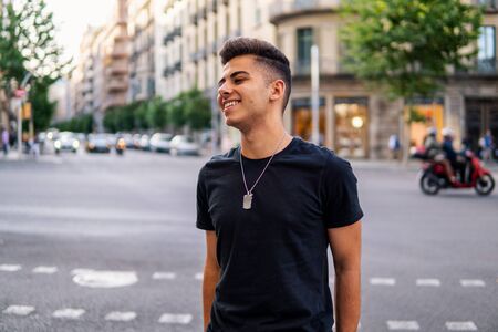 fashionable handsome man on the street of modern cityの写真素材
