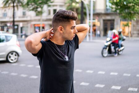 fashionable handsome man on the street of modern cityの写真素材