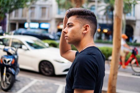 fashionable handsome man on the street of modern cityの写真素材
