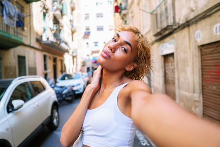 sexy shemale woman posing and doing selfieの写真素材