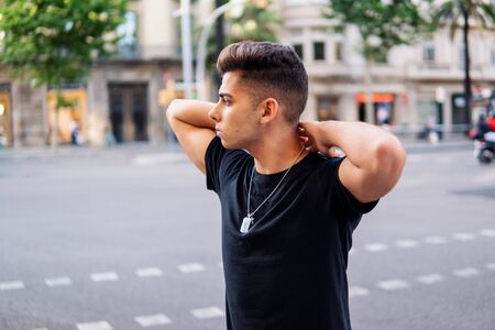 fashionable handsome man on the street of modern cityの写真素材