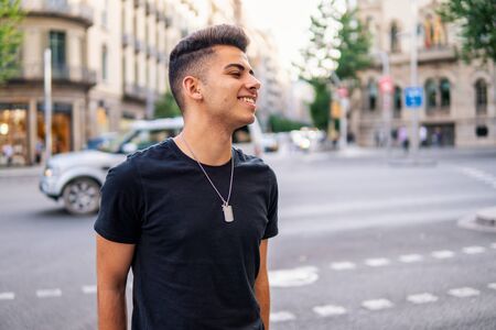 fashionable handsome man on the street of modern cityの写真素材