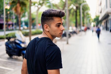 fashionable handsome man on the street of modern cityの写真素材