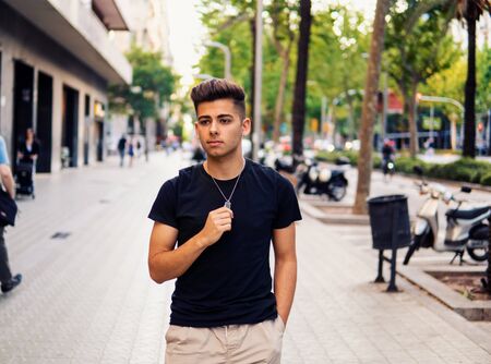 fashionable handsome man on the street of modern cityの写真素材
