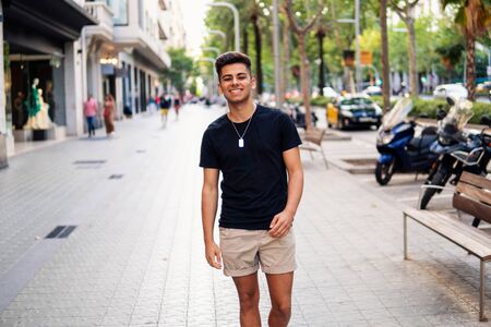 fashionable handsome man on the street of modern cityの写真素材
