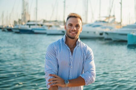 Young rich man at Yacht Club. Businessman is Relaxingの写真素材