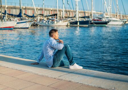 Young rich man at Yacht Club. Businessman is Relaxingの写真素材