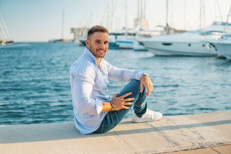 Young rich man at Yacht Club. Businessman is Relaxingの写真素材
