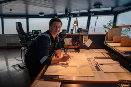 Marine navigational officer during navigational watch on Bridgeの写真素材