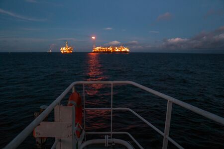 FPSO tanker vessel near Oil Rig platform. Offshore oil and gas industryの写真素材
