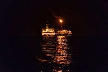 Night view of FPSO tanker vessel near Oil Rigの写真素材
