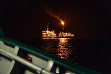 Night view of FPSO tanker vessel near Oil Rig.の写真素材