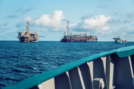 FPSO tanker vessel near Oil Rig platform. Offshore oil and gas industryの写真素材