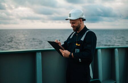 Deck Officer on deck of offshore vessel or ship , wearing PPE personal protective equipmentの写真素材