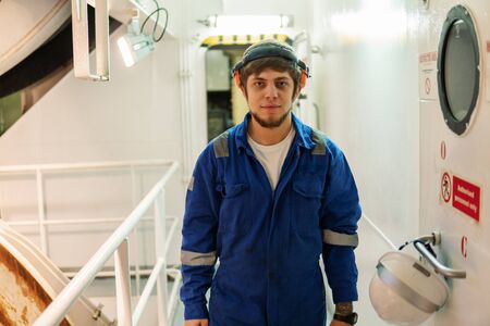 Marine engineer works on the ship. Seamens workの写真素材