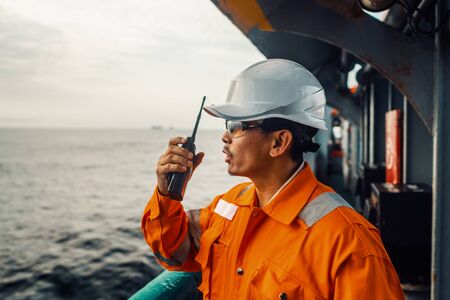 Filipino deck Officer on deck of vessel or ship , wearing PPE personal protective equipmentの写真素材