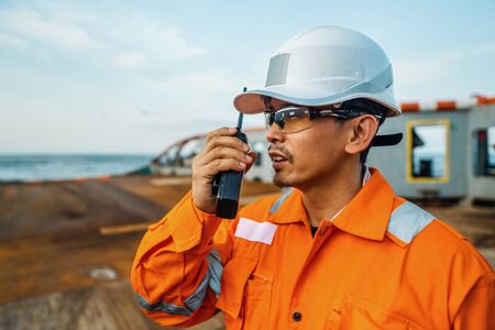 Filipino deck Officer on deck of vessel or ship , wearing PPE personal protective equipmentの写真素材