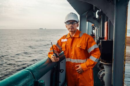 Filipino deck Officer on deck of vessel or ship , wearing PPE personal protective equipmentの写真素材