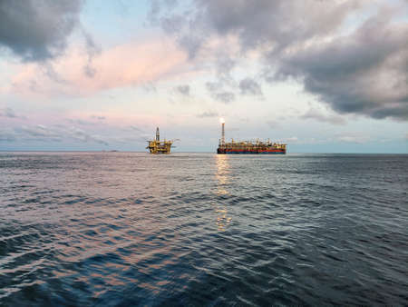 FPSO tanker vessel near Oil Rig platform. Offshore oil and gas industryの写真素材