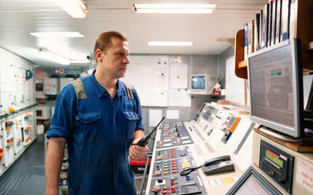 Marine Engineer working on radio communication at Engine Control room ECR