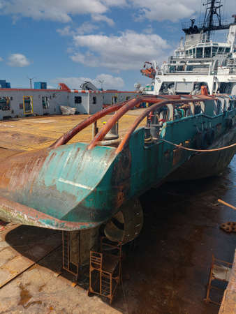 Industry view - Ocean Vessel in the dry dock in shipyard. Old rusty ship under repairの写真素材