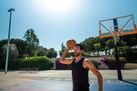 basketball player throws a ball that to another player. pass in the game.の写真素材