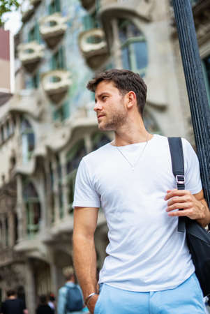 Handsome young man on urban streetの写真素材