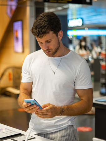 Man buying new gadget in storeの写真素材