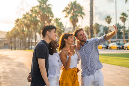 Happy diverse friends taking selfieの写真素材