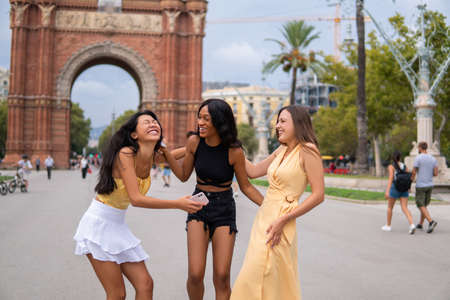 Multiethnic women having fun in cityの写真素材