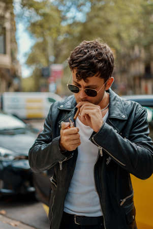 Portrait of sexy man smokingの写真素材