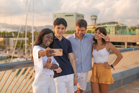 Group of diverse students taking selfieの写真素材