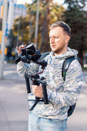 Professional videographer with gimball video setup during shootingの写真素材