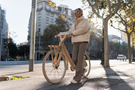 Stylish woman with eco friendly bicycleの写真素材