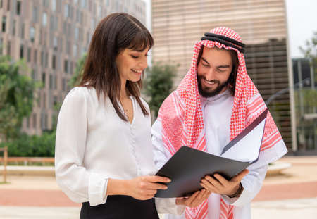 Cheerful diverse business partners reading documentsの写真素材