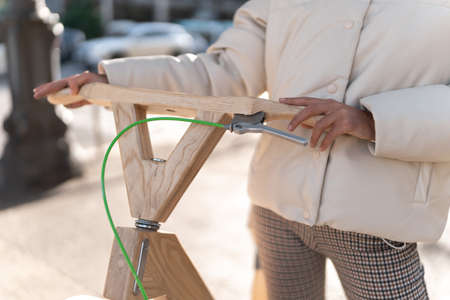 Unrecognizable woman with lumber bicycleの写真素材