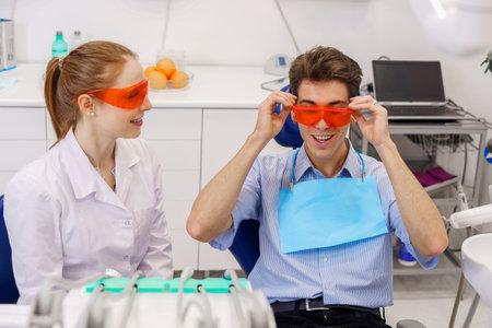 Dentist and patient with protective gogglesの写真素材