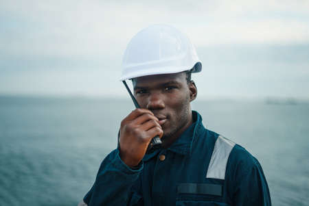 Seaman AB or Bosun on deck of vessel or shipの写真素材