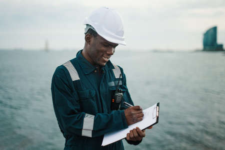 Marine navigational officer or chief mate on navigation watch on ship or vesselの写真素材