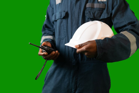 Crop black mariner with hardhat and radioの写真素材