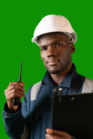 Confident black mariner with clipboard and walkie talkieの写真素材