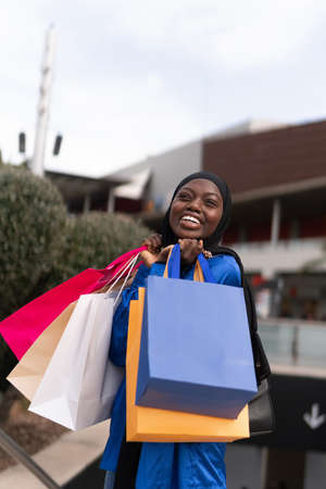 Glad black shopper with paper bagsの写真素材