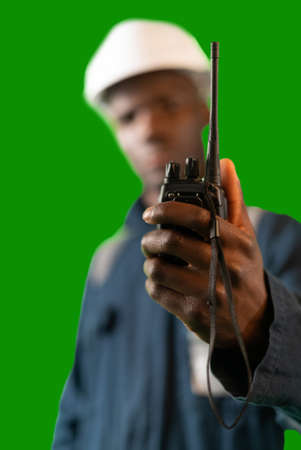 Anonymous black seafarer using walkie talkieの写真素材