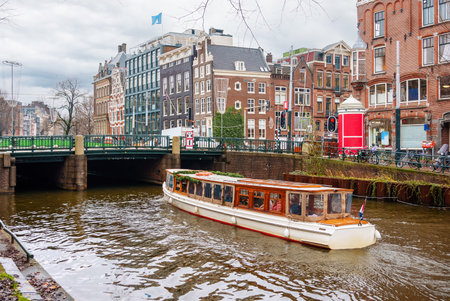 Channel in Amsterdam Netherlands houses river Amstel landmark old european city landscapeの写真素材