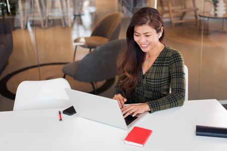 Content modern lady working on laptopの写真素材