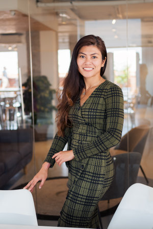 Smiling female worker in modern officeの写真素材