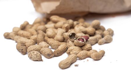 Useful peanut, close-up, isolated on white background. Protein source. Healthy food